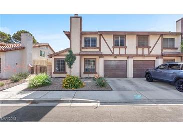 Charming townhome with a well-manicured front yard and an attached two-car garage at 110 Huckleberry Ln, Henderson, NV 89074