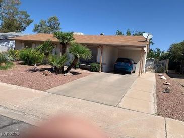 Charming single-story home with a carport and low-maintenance desert landscaping in front at 225 Dogwood St, Henderson, NV 89015