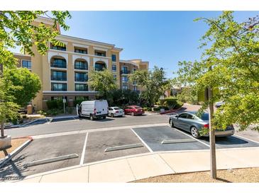 Exterior of building featuring architectural details and parking area at 29 Montelago Blvd # 209, Henderson, NV 89011
