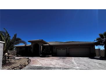 Spacious single-story home featuring an attached garage and desert landscaping at 4011 Scott Russell Ct, North Las Vegas, NV 89031
