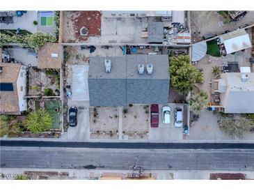 An aerial view shows the well maintained roof and yard space and multiple parking spots at 615 N 4Th St, Las Vegas, NV 89101