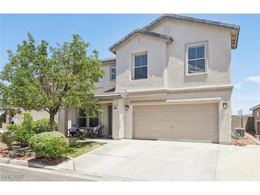 Charming two-story home featuring a well-maintained front yard and an attached two-car garage at 3966 Crystal Trip Ct, Las Vegas, NV 89129