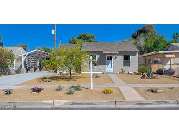 Charming single-story home featuring a well-maintained yard and a convenient covered parking area at 524 Hopi Pl, Boulder City, NV 89005