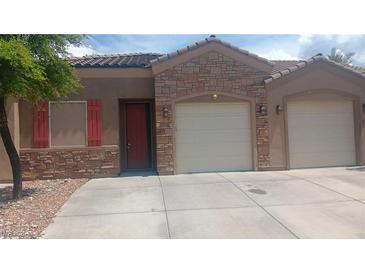 Charming single-story home with a stone facade and three-car garage at 864 Chianti Way, Mesquite, NV 89027