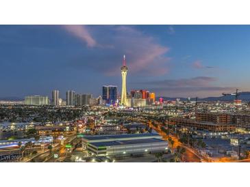 Expansive city skyline view featuring a vibrant display of lights and iconic landmarks at twilight at 900 S Las Vegas Blvd # 1208, Las Vegas, NV 89101