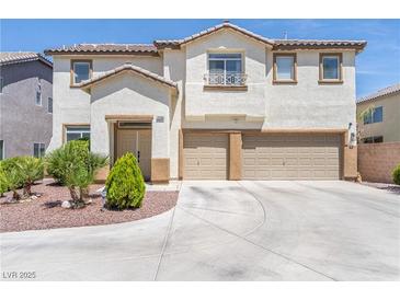Inviting two-story home featuring a spacious three-car garage and well-manicured front yard at 11134 Casala Ct, Las Vegas, NV 89141