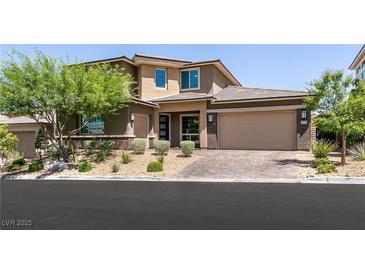 Beautiful two-story home featuring a three-car garage and well-manicured landscaping at 2680 Nevada Agave Ln, Las Vegas, NV 89138