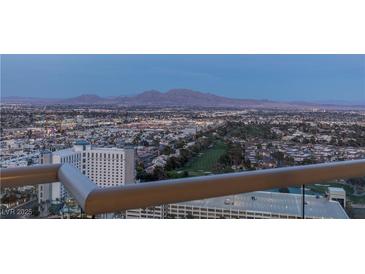 Stunning city view from balcony featuring a golf course, residential areas and distant mountains at 2777 Paradise Rd # 2302, Las Vegas, NV 89109