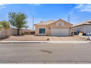 Charming single-story home with a two-car garage and low maintenance desert landscaping at 5317 Marietta Ave, Las Vegas, NV 89108