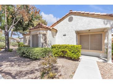 Charming single-story home featuring a stucco exterior and meticulously maintained landscaping at 5400 Paul Kurtz Way # 105, Las Vegas, NV 89108