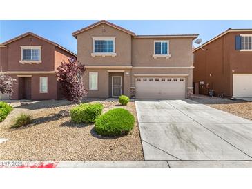 Two-story home featuring desert landscaping and an attached two-car garage at 9173 Weeping Hollow Ave, Las Vegas, NV 89178