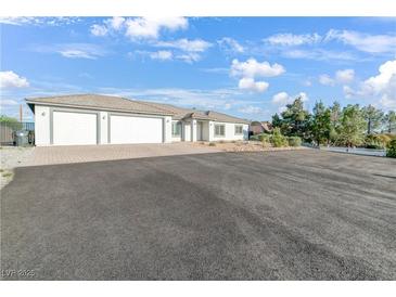 Beautiful single-story home with three-car garage and circular driveway at 2261 Pampa Ave, Pahrump, NV 89048