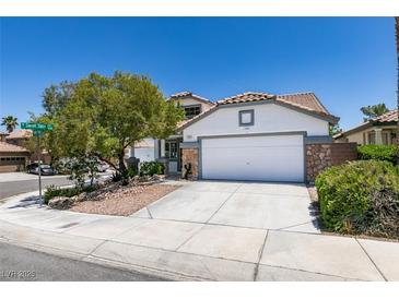 Charming single-Gathering home featuring a two-car garage and low-maintenance desert landscaping at 3336 Hidden Ridge St, Las Vegas, NV 89129