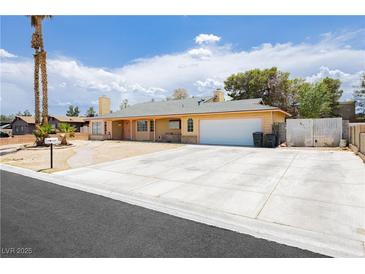Charming single-story home featuring a two-car garage and a spacious driveway at 4205 Thicket Ave, North Las Vegas, NV 89031