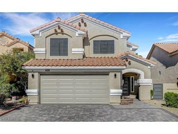 Charming two-story home with a red tile roof, neutral stucco and a spacious two car garage at 8316 Maplestar Rd, Las Vegas, NV 89128