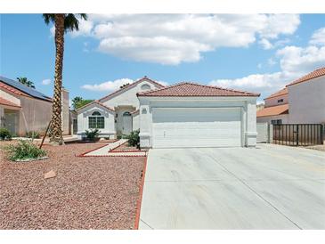 Charming single-story home featuring a well-maintained front yard and a two-car garage in a sunny setting at 628 Bay Bridge Dr, North Las Vegas, NV 89032