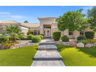 Charming single-story home featuring an inviting entrance and well-manicured landscaping at 7411 Brittlethorne Ave, Las Vegas, NV 89131