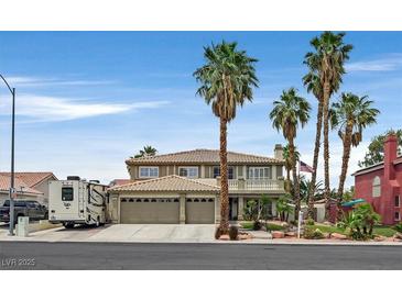 Two-story home showcasing a three-car garage, desert landscaping, and towering palm trees at 928 Aspen Valley Ave, Las Vegas, NV 89123