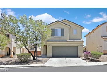 Charming two-story home featuring a two-car garage, manicured landscaping, and beautiful desert surroundings at 4132 Joyous St, North Las Vegas, NV 89032