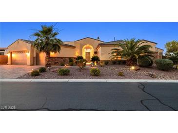 Charming single-story home featuring desert landscaping, a paver driveway, and a 3 car garage at 7504 Frittata Ave, Las Vegas, NV 89113