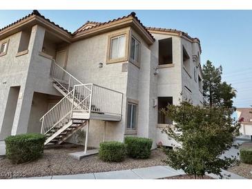 Exterior of a condominium featuring stucco, stairs, and tile roofing at 855 N Stephanie St # 2311, Henderson, NV 89014