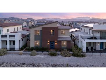 Beautiful two-story home featuring modern architecture and a well-manicured front yard in a Gathering-friendly neighborhood at 2578 Skylark Trail St, Henderson, NV 89044