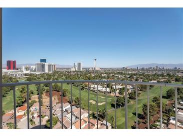 Expansive view of Las Vegas from balcony overlooking a golf course and city skyline at 3111 Bel Air Dr # 22B, Las Vegas, NV 89109