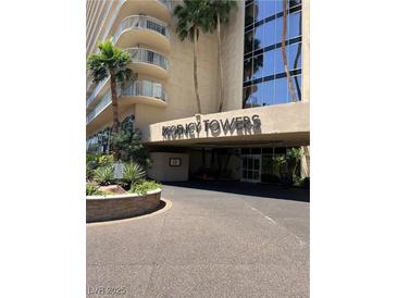 Inviting Regency Towers entrance featuring manicured landscaping and porte cochere at 3111 Bel Air Dr # 22B, Las Vegas, NV 89109