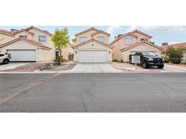Charming two-story home featuring a well-maintained front yard and a two-car garage at 4552 Aviation St, Las Vegas, NV 89115