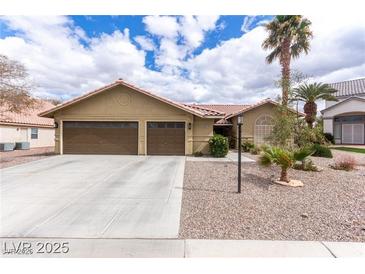 Quaint one-story home features desert landscaping and a two-car garage at 10058 Saint Augustine St, Las Vegas, NV 89183