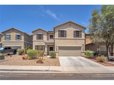 Charming two-story home featuring a two-car garage and low-maintenance landscaping at 184 Bird Cove Ave, Henderson, NV 89011