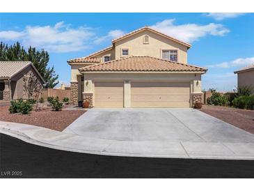 Charming two-story home boasts a spacious three-car garage and a well-maintained front yard with rock landscaping at 2684 Korea Ct, Henderson, NV 89052