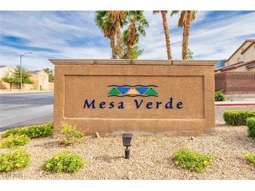 Mesa Verde community sign with desert landscaping, palm trees, and bright blue sky at 3728 Juanita May Ave, North Las Vegas, NV 89032