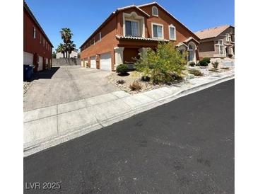 A two-story home featuring an inviting exterior with a private driveway and well-kept landscaping at 3759 Sand Pier St, Las Vegas, NV 89147