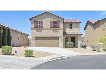 Two-story home with a beige stucco finish, red shutters, and a two-car garage in a suburban neighborhood at 5250 Chester Creek Ct, Las Vegas, NV 89141