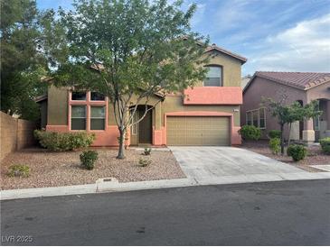Charming two-story home with desert landscaping, covered porch, and two-car garage at 5861 Varese Dr, Las Vegas, NV 89141