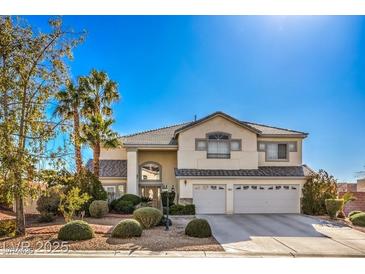 Charming two-story home with well-manicured landscaping and a three-car garage at 6971 Cedar Basin Ave, Las Vegas, NV 89142
