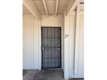 Entry door with security screen and the number 27 to the right at 5390 Swenson St # 27, Las Vegas, NV 89119