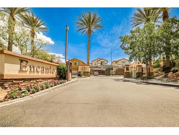 Gated community entrance with sign and landscaping provides security and aesthetic appeal at 7083 Somera Way, Las Vegas, NV 89113