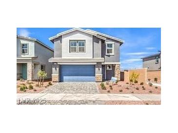 Charming two-story home with a two-car garage and low maintenance landscaping at 1027 Gentle Swan St # 689, Henderson, NV 89011