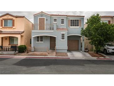 Charming two-story home with a front porch, balcony, and a well-maintained front yard at 10373 Perfect Parsley St, Las Vegas, NV 89183