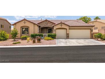 Charming single-story home featuring a well-manicured front yard and a spacious three-car garage at 1413 Gentle Brook St, North Las Vegas, NV 89084
