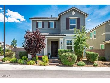 Charming two-story home featuring a manicured front yard and a welcoming entrance in a residential neighborhood at 3531 Montepulciano Ln, Henderson, NV 89044