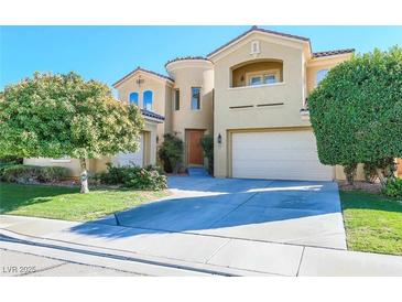 Charming two-story home with a well-manicured lawn and an attached two-car garage at 5043 Gable Crest Ct, Las Vegas, NV 89141