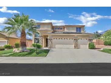 Charming two-story home with a well-maintained front yard and three car garage at 2382 Sunburst View St, Henderson, NV 89052