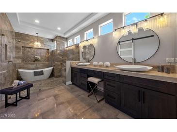 Elegant bathroom featuring dual sinks, modern fixtures, freestanding tub and a separate shower at 2548 Faiss Dr, Las Vegas, NV 89134