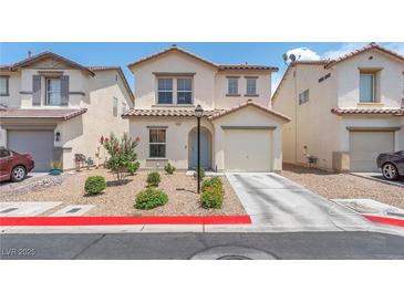 Charming two-story home featuring a desert landscape, attached garage, and inviting front entrance at 4252 Olympic Point Dr, Las Vegas, NV 89129