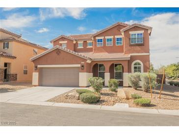 Charming two-story home featuring a two-car garage and meticulously landscaped front yard at 7316 Childers Ave, Las Vegas, NV 89178