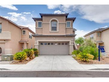 Charming two-story home with a two-car garage, desert landscaping, and inviting curb appeal at 8745 Dodds Canyon St, Las Vegas, NV 89131