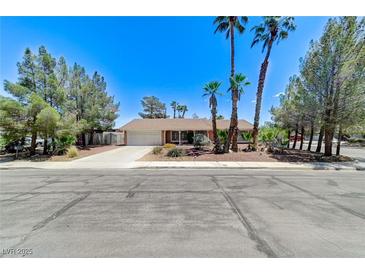 Charming single story home featuring a spacious driveway and xeriscaped front yard at 3360 Paso Andres St, Las Vegas, NV 89146